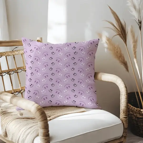 Pillow on bamboo couch with purple smiles