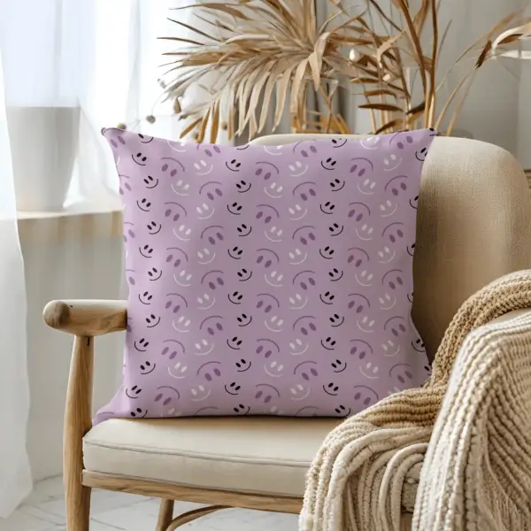 Pillow on bamboo couch with purple smiles