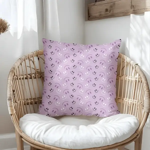 Pillow on bamboo couch with purple smiles