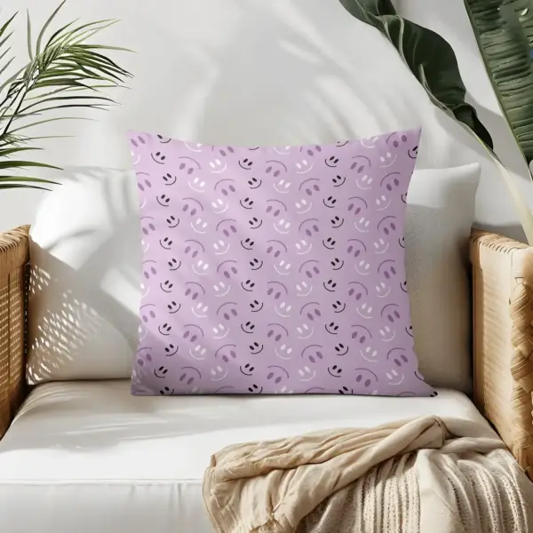 Pillow on bamboo couch with purple smiles