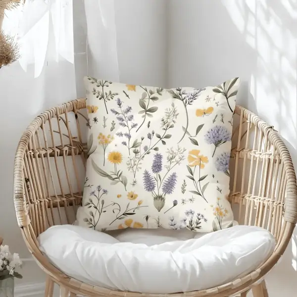 Pillow on bamboo couch with botanical illustrations