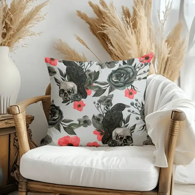 Pillow on bamboo couch with skull and flowers